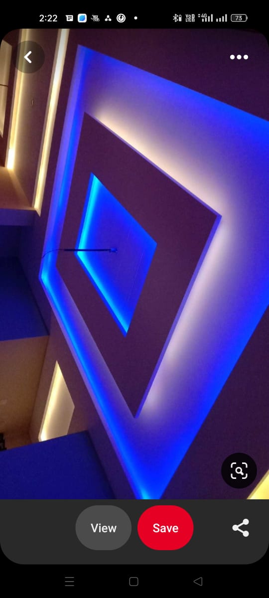 Geometric decorative ceiling design with blue and warm LED backlighting