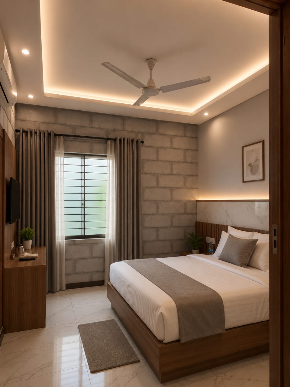 Bedroom false ceiling with recessed spotlights and warm cove lighting in Bengaluru
